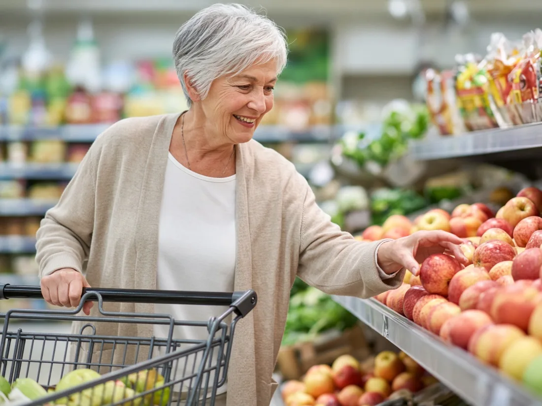 A woman in her sixties shopping for groceries
